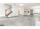 Open-concept living area with staircase, adjoining kitchen and breakfast nook, perfect for entertaining at 539 Riverbirch Trce, Stone Mountain, GA 30087