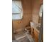 Modest bathroom featuring a toilet, vanity with sink, and tile flooring at 2911 Chesterfield Se Way, Conyers, GA 30013