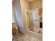 Bathroom with sliding glass shower door, toilet, and window providing natural light at 2911 Chesterfield Se Way, Conyers, GA 30013