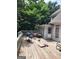 Spacious outdoor deck perfect for entertaining with a grill and outdoor seating area at 2911 Chesterfield Se Way, Conyers, GA 30013