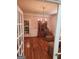 Dining room boasts hardwood floors, cabinet, and light fixture at 2911 Chesterfield Se Way, Conyers, GA 30013