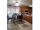 Kitchen and breakfast area featuring tile floors, oak cabinets, and natural light at 2911 Chesterfield Se Way, Conyers, GA 30013
