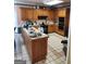 Spacious kitchen with wooden cabinets, tile countertops, and range at 2911 Chesterfield Se Way, Conyers, GA 30013