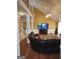 Bright living room with tall ceilings, seamlessly connecting to other areas in the home at 2911 Chesterfield Se Way, Conyers, GA 30013