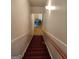 Carpeted stairway with wood handrail at 2911 Chesterfield Se Way, Conyers, GA 30013