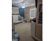 Bedroom with a crib, world map wall decor, window, and ceiling fan at 1524 Queen Elizabeth Dr, Locust Grove, GA 30248