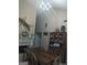 Dining room with vaulted ceiling, a rustic chandelier and a view of the fireplace at 1524 Queen Elizabeth Dr, Locust Grove, GA 30248