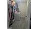 A utility room with a washer and dryer and storage at 1524 Queen Elizabeth Dr, Locust Grove, GA 30248