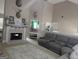 Inviting living room featuring a cozy fireplace and comfortable seating at 1524 Queen Elizabeth Dr, Locust Grove, GA 30248