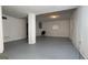 Spacious basement with gray flooring, light walls and support column at 8436 Magnolia Dr, Jonesboro, GA 30238