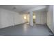 Basement with light walls, light ceiling and gray painted floor at 8436 Magnolia Dr, Jonesboro, GA 30238