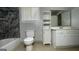 Neutral toned bathroom features a tiled shower and cabinet at 8436 Magnolia Dr, Jonesboro, GA 30238