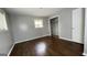 Neutral bedroom with dark hardwood floors and a closet at 8436 Magnolia Dr, Jonesboro, GA 30238