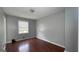 A standard bedroom has gray walls and a window at 8436 Magnolia Dr, Jonesboro, GA 30238