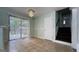Open dining room features a sliding door to the deck and adjacent staircase at 8436 Magnolia Dr, Jonesboro, GA 30238