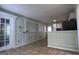 Open kitchen and dining space with neutral walls, decorative molding, and tile flooring at 8436 Magnolia Dr, Jonesboro, GA 30238