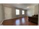 Spacious living room with hardwood floors, neutral paint, and plenty of natural light at 8436 Magnolia Dr, Jonesboro, GA 30238