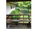 Outdoor deck overlooking a landscaped backyard with blooming hydrangeas at 177 Northwind Sw Ct, Lilburn, GA 30047