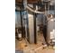 Image shows basement utility components, including the furnace, water heater, and ductwork at 177 Northwind Sw Ct, Lilburn, GA 30047