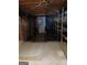 Unfinished basement with exposed rafters and shelving, offering customization at 177 Northwind Sw Ct, Lilburn, GA 30047
