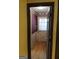 Entryway with wood floors, wainscoting, and decorative wallpaper, creating a charming entrance at 177 Northwind Sw Ct, Lilburn, GA 30047