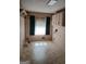 Bright laundry room with tile floor and white cabinets ready for appliances at 177 Northwind Sw Ct, Lilburn, GA 30047