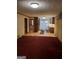 Open concept living room showcasing hardwood floors leading into the kitchen at 177 Northwind Sw Ct, Lilburn, GA 30047