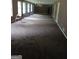 Spacious Living Room with large windows and soft carpeting at 177 Northwind Sw Ct, Lilburn, GA 30047