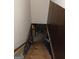 View of wooden stairs leading down, possibly to a basement or lower level area at 177 Northwind Sw Ct, Lilburn, GA 30047