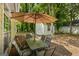 Backyard patio with umbrella-covered table and an outbuilding/shed on the property at 539 Horseshoe Cir, Stockbridge, GA 30281