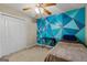 Bedroom features an accent wall, closet, carpeted floor, and a ceiling fan at 539 Horseshoe Cir, Stockbridge, GA 30281