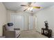 Cozy bedroom features a ceiling fan, plush carpeting, and ample closet space at 539 Horseshoe Cir, Stockbridge, GA 30281