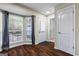Entryway featuring hardwood floors, natural light from a bay window, and white doors at 539 Horseshoe Cir, Stockbridge, GA 30281
