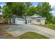 Charming home with a two-car garage, bay window, and neatly manicured front lawn at 539 Horseshoe Cir, Stockbridge, GA 30281