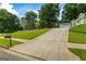 Inviting home featuring manicured front lawn, attached two-car garage and elongated driveway at 539 Horseshoe Cir, Stockbridge, GA 30281