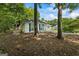 View of home exterior showing painted brick and wooded surroundings at 539 Horseshoe Cir, Stockbridge, GA 30281