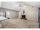 Spacious living room featuring a fireplace, vaulted ceiling, and large doorway at 539 Horseshoe Cir, Stockbridge, GA 30281