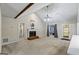 Living room with a brick fireplace, vaulted ceilings, carpeted floor, and neutral paint at 539 Horseshoe Cir, Stockbridge, GA 30281