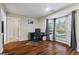 Living area with a bay window, hardwood floors, and access to two additional rooms at 539 Horseshoe Cir, Stockbridge, GA 30281