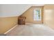 Attic room with sloped ceilings and a window at 10044 Point View Dr, Jonesboro, GA 30238