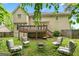 Beautiful backyard with a deck, a fire pit, and plenty of seating to enjoy the outdoors at 10044 Point View Dr, Jonesboro, GA 30238