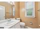 Bathroom features a white vanity and ample natural light at 10044 Point View Dr, Jonesboro, GA 30238