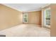 Bright and airy bedroom with neutral carpet, large windows, and ample natural light at 10044 Point View Dr, Jonesboro, GA 30238