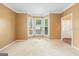 Cozy room with carpet and large windows at 10044 Point View Dr, Jonesboro, GA 30238