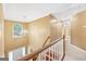 Hallway with staircase and chandelier at 10044 Point View Dr, Jonesboro, GA 30238