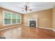 Spacious living room features hardwood floors and a stone fireplace at 10044 Point View Dr, Jonesboro, GA 30238
