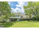 Spacious backyard with a covered patio and deck, ideal for outdoor gatherings at 1493 Vesta Ave, Atlanta, GA 30337