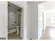 Classic bathroom with white tiles, pedestal sink, and bathtub at 1493 Vesta Ave, Atlanta, GA 30337