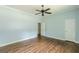 Bedroom featuring hardwood floors, a ceiling fan, and two doorways at 1493 Vesta Ave, Atlanta, GA 30337