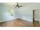 Bedroom with hardwood floors, ceiling fan, and natural light from window at 1493 Vesta Ave, Atlanta, GA 30337